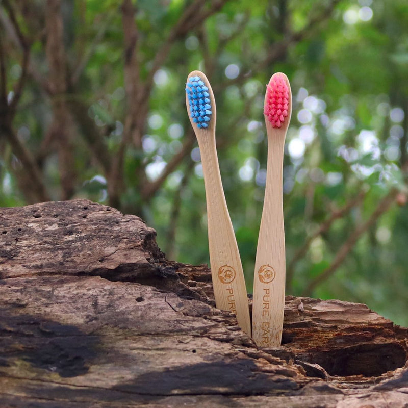 pink and blue childs bamboo toothbrushes