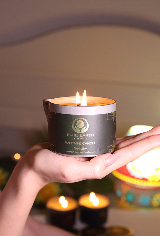 hand holding massage oil candle